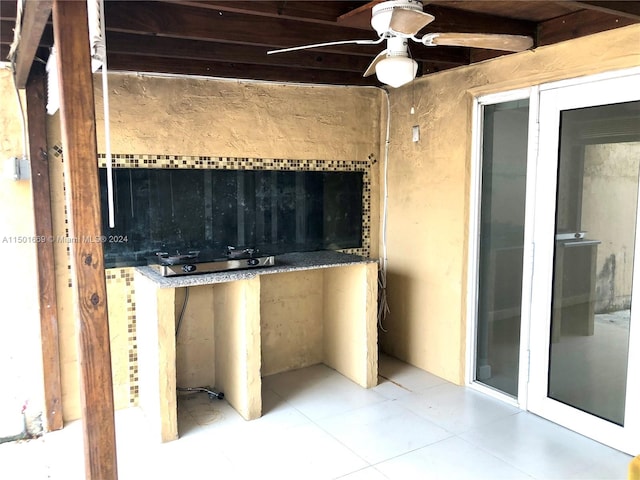 interior space featuring ceiling fan