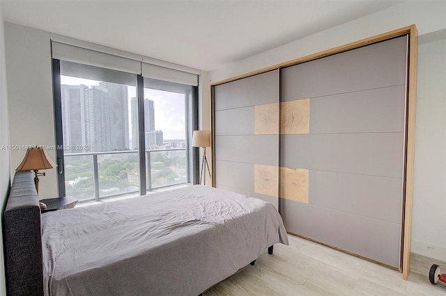 bedroom with light hardwood / wood-style flooring