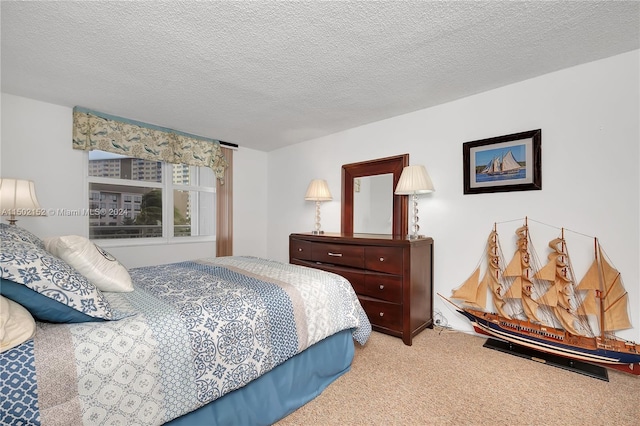 carpeted bedroom with a textured ceiling