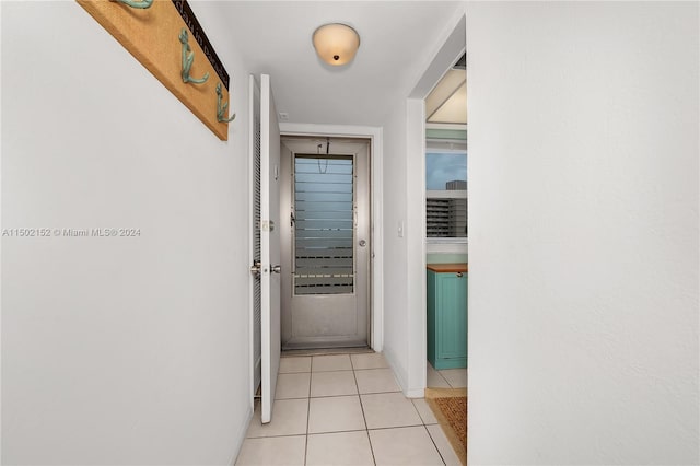 hallway with light tile patterned floors