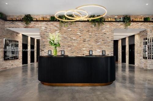 reception area featuring an inviting chandelier