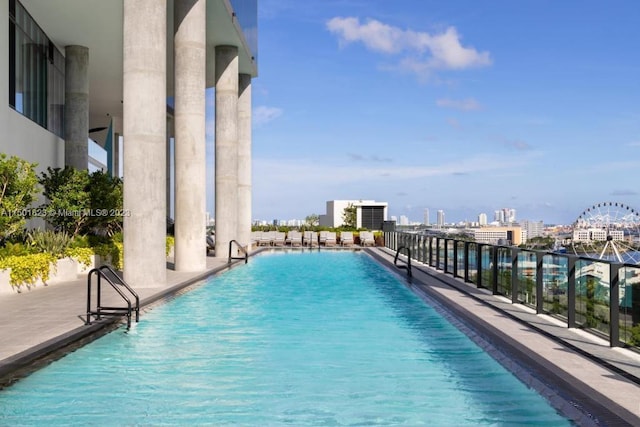 view of swimming pool with a water view