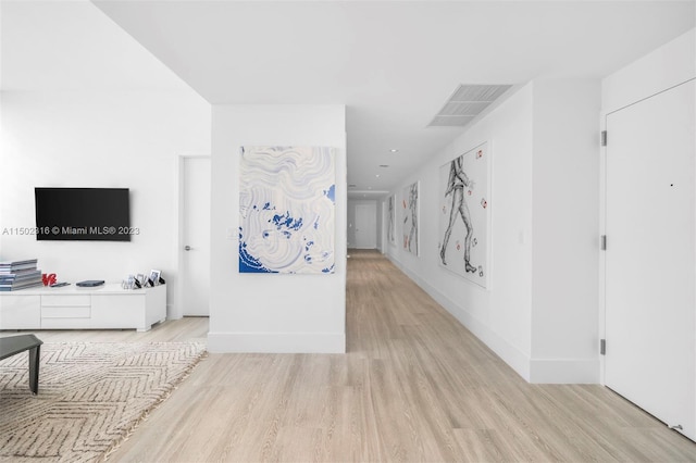 living room with light hardwood / wood-style flooring