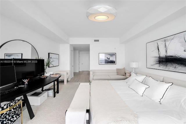 bedroom with light colored carpet