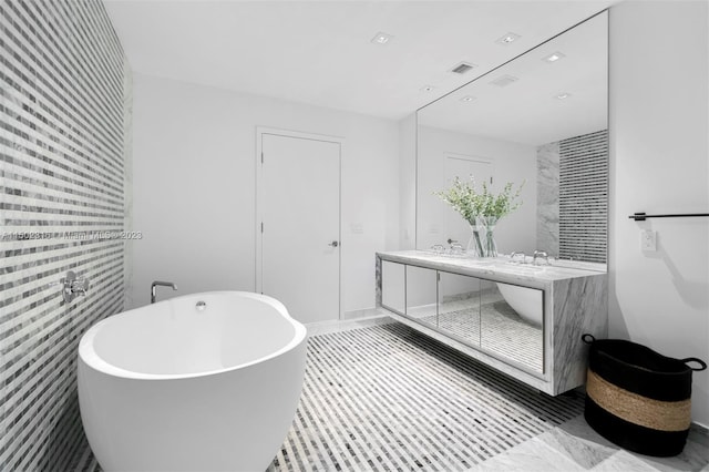 bathroom featuring vanity and a bathtub