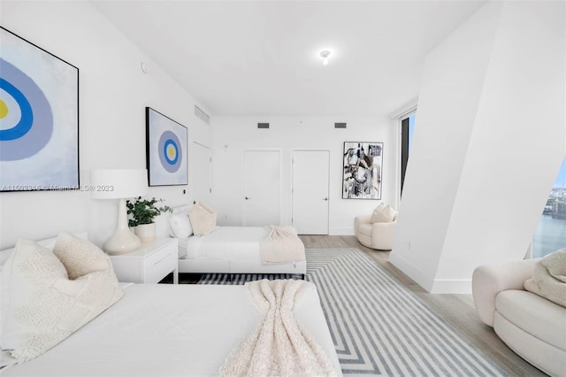 bedroom featuring light wood-type flooring