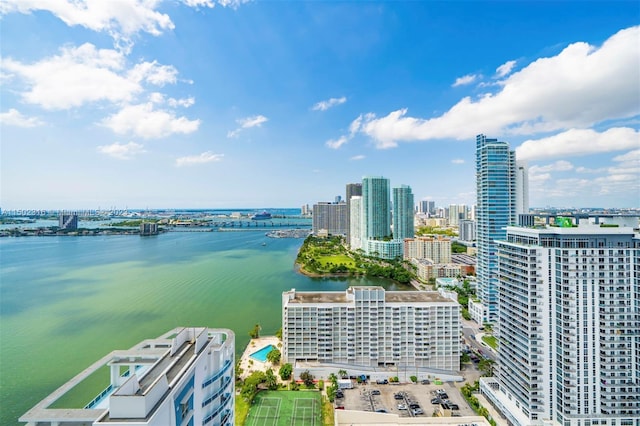 birds eye view of property with a water view