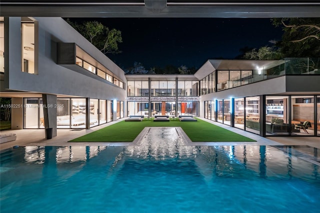 5245 Oak Ln, Coral Gables, FL 33156 - pool at twilight featuring an outdoor pool and a patio