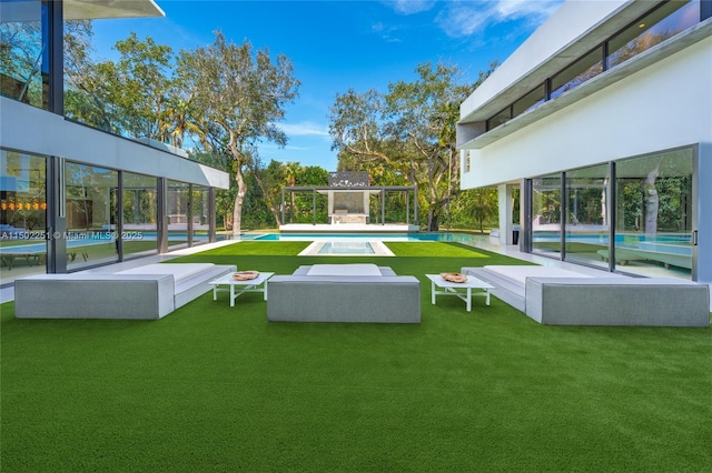 view of home's community with a yard, a swimming pool, and outdoor lounge area