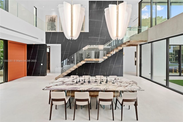 dining area featuring a high ceiling