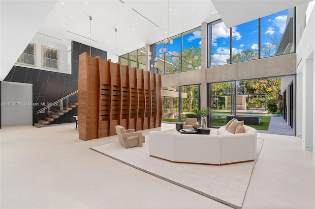 living room with a towering ceiling