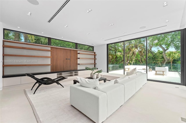 5245 Oak Ln, Coral Gables, FL 33156 - living area featuring concrete floors and floor to ceiling windows