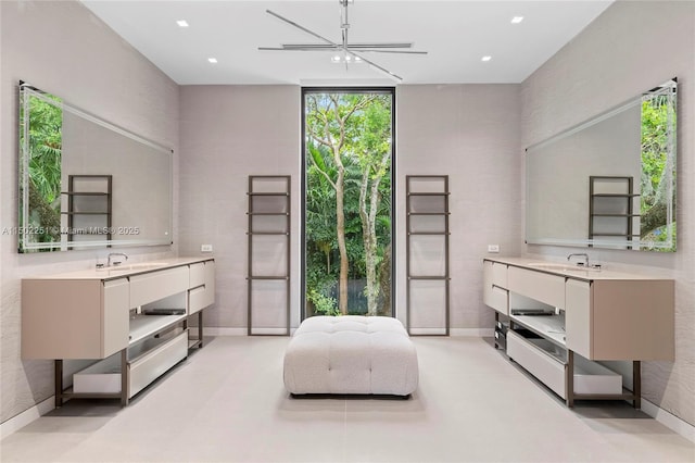 sitting room featuring sink and a wall of windows