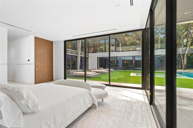 bedroom featuring a wall of windows