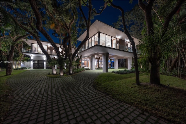 5245 Oak Ln, Coral Gables, FL 33156 - view of front of home featuring curved driveway and stucco siding