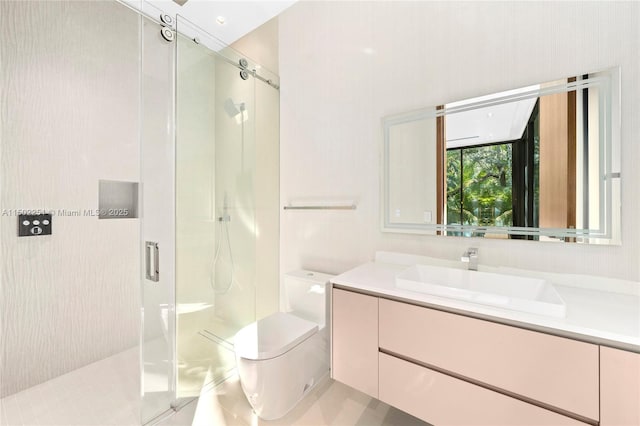 bathroom with vanity, toilet, and walk in shower