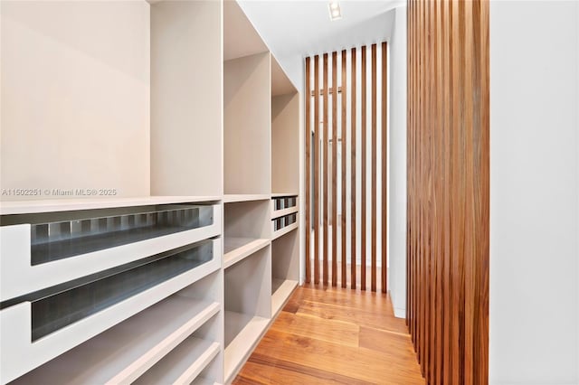 corridor with light hardwood / wood-style flooring