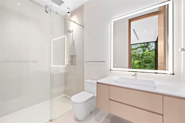 bathroom with vanity, an enclosed shower, and toilet