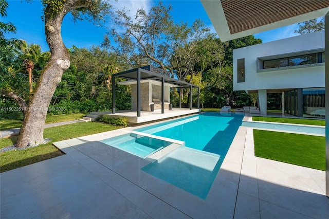 view of swimming pool with a lawn, a patio, and an in ground hot tub