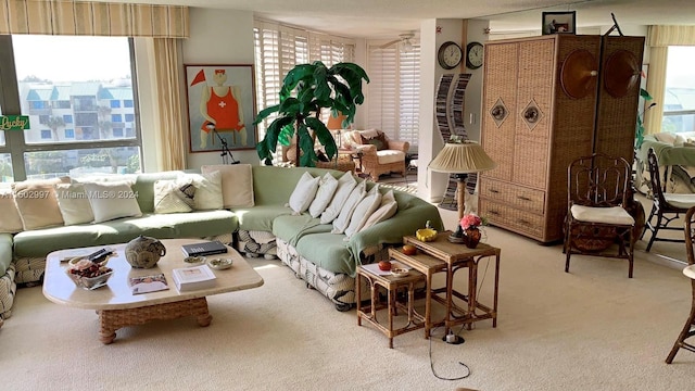 living room featuring carpet floors and a healthy amount of sunlight