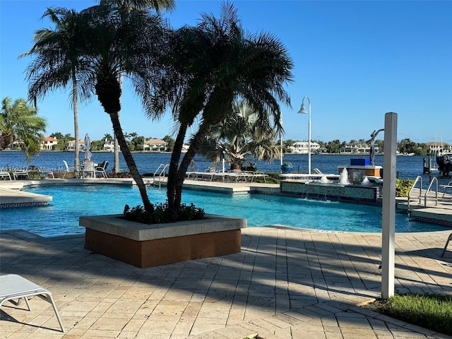 community pool featuring a patio area