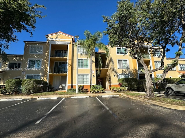 view of property with uncovered parking