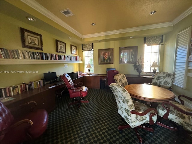 interior space with crown molding, built in desk, visible vents, and a healthy amount of sunlight