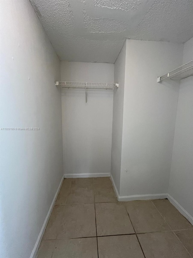 walk in closet featuring tile patterned floors