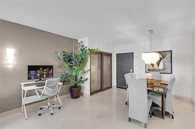 dining area featuring an inviting chandelier