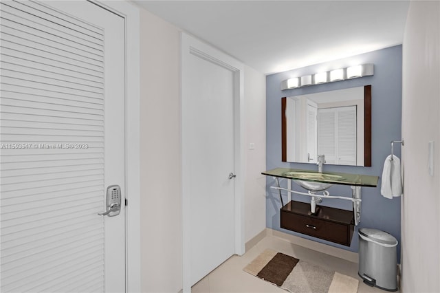 bathroom with tile patterned flooring and sink