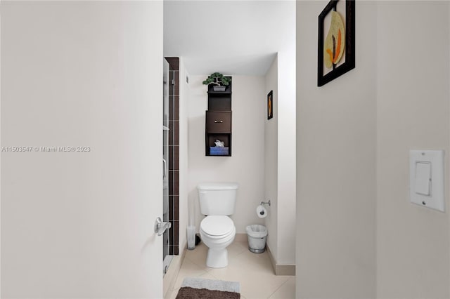 bathroom with tile patterned flooring and toilet