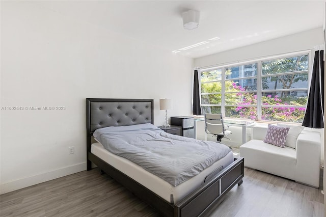 bedroom with light hardwood / wood-style flooring