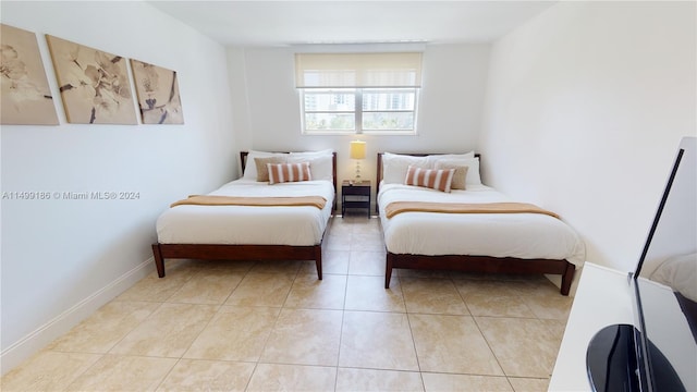 bedroom with light tile patterned flooring