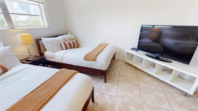 bedroom featuring light tile patterned floors