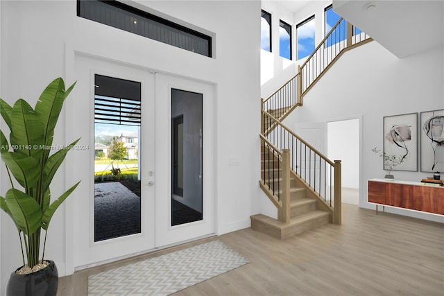 5735 SW 104th Ter, Cooper City, FL 33328 - foyer entrance featuring light hardwood / wood-style flooring and french doors