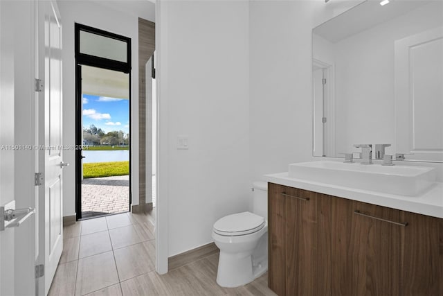 5735 SW 104th Ter, Cooper City, FL 33328 - bathroom featuring vanity, tile flooring, and toilet