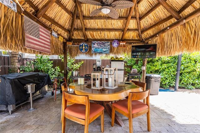 view of patio / terrace featuring a grill, ceiling fan, and a gazebo