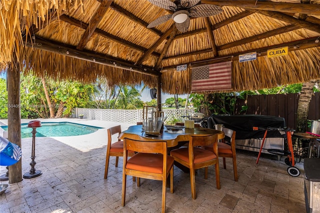 view of pool with a grill, ceiling fan, and a gazebo