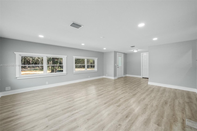 unfurnished living room with light wood-type flooring