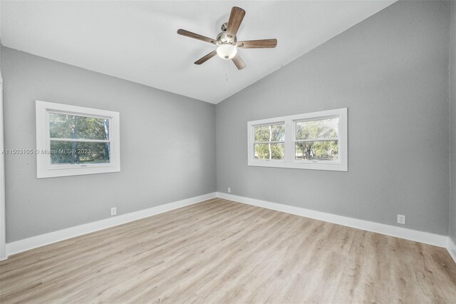 104 Ballard, Avon Park, FL 33825 - empty room with vaulted ceiling, wood finished floors, a ceiling fan, and baseboards