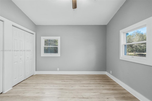 unfurnished bedroom with light hardwood / wood-style flooring and ceiling fan