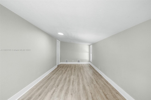 spare room featuring light hardwood / wood-style flooring