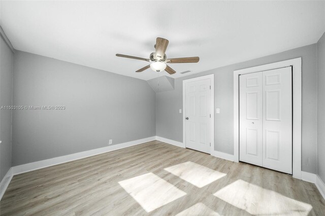 104 Ballard, Avon Park, FL 33825 - unfurnished bedroom featuring light wood finished floors, baseboards, a ceiling fan, and a closet