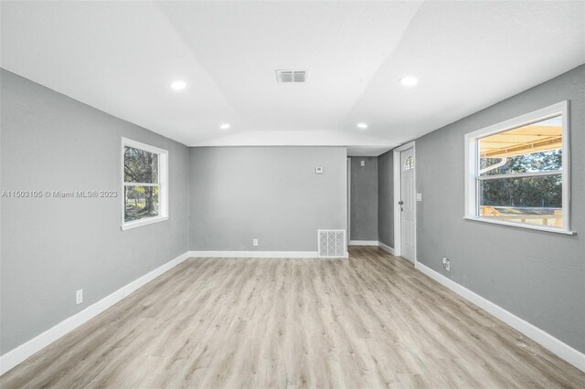 104 Ballard, Avon Park, FL 33825 - empty room featuring recessed lighting, light wood-style floors, baseboards, plenty of natural light, and lofted ceiling
