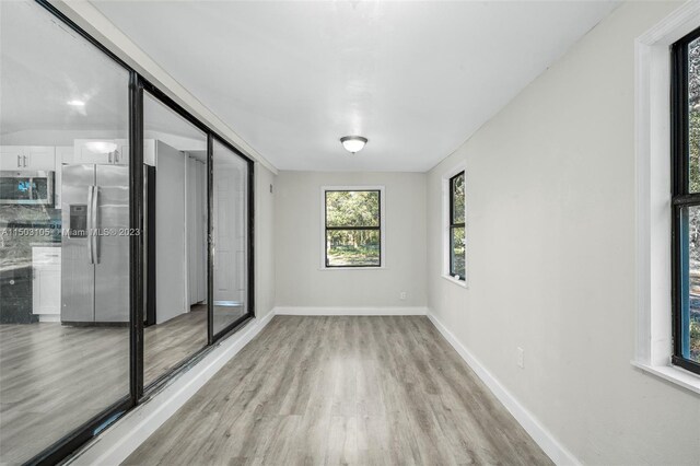 104 Ballard, Avon Park, FL 33825 - empty room featuring light wood finished floors and baseboards