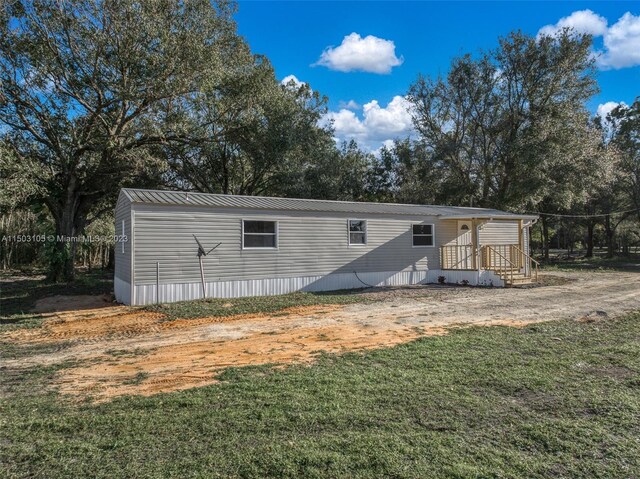 104 Ballard, Avon Park, FL 33825 - view of outdoor structure with view of wooded area