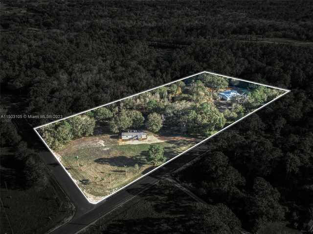 104 Ballard, Avon Park, FL 33825 - aerial overview of property's location featuring a heavily wooded area and property boundaries highlighted