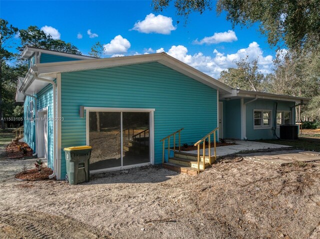 104 Ballard, Avon Park, FL 33825 - rear view of house with central air condition unit