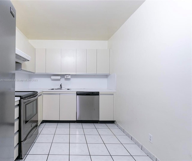 kitchen with white cabinetry, sink, appliances with stainless steel finishes, and light tile patterned floors