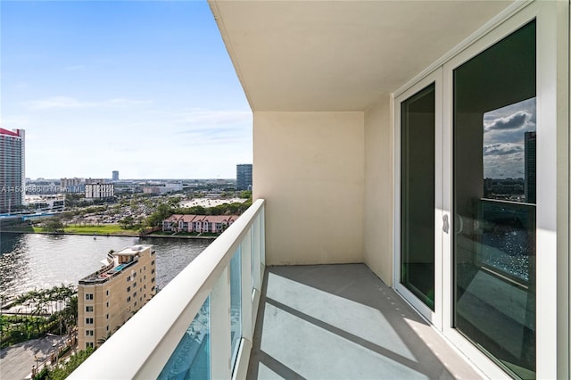 balcony featuring a water view